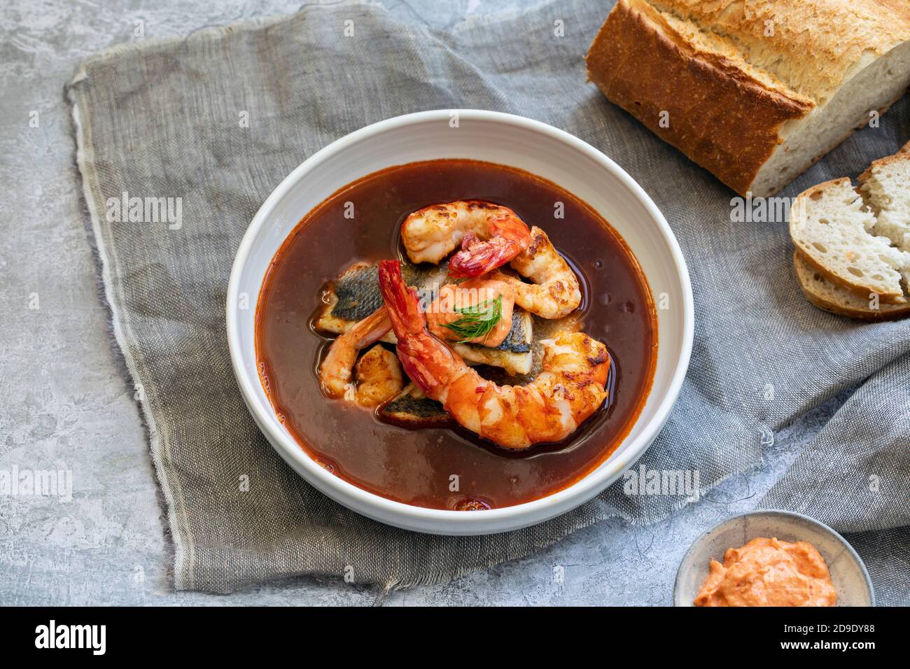 Bouillabaiss, French fish soup with sea bass and prawns Stock Photo