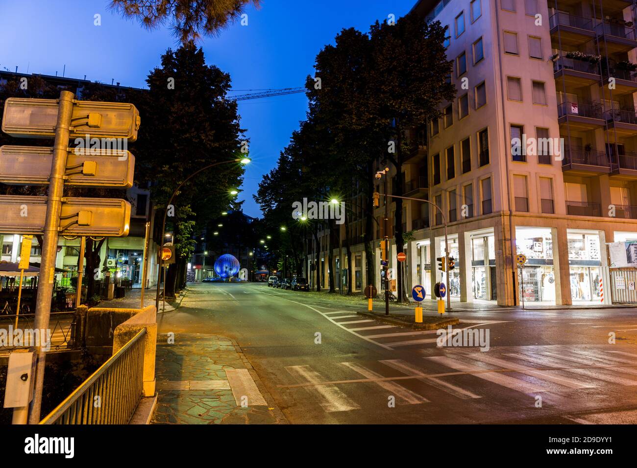 Empty crossroad with street lights at night. Treviso Italy Stock Photo