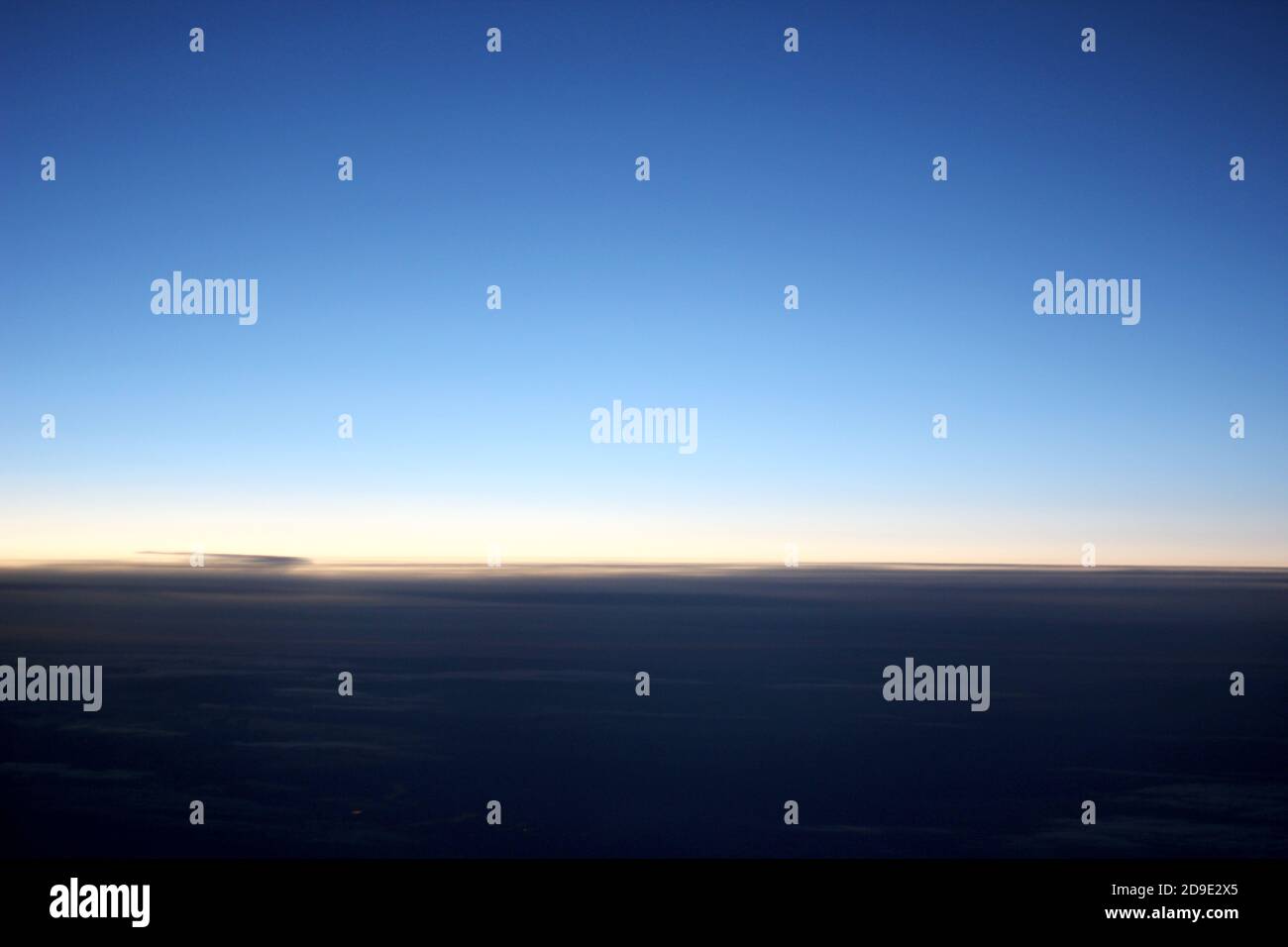 blue sky above clouds from the plane window Stock Photo - Alamy