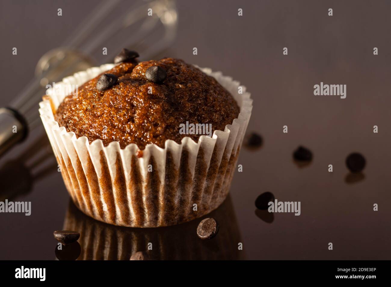 selective focus on a homemade cup cake muffin on glossy reflecting surface Stock Photo