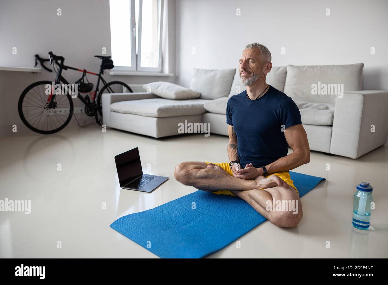 Caucasian athletic person enjoying a morning meditation Stock Photo