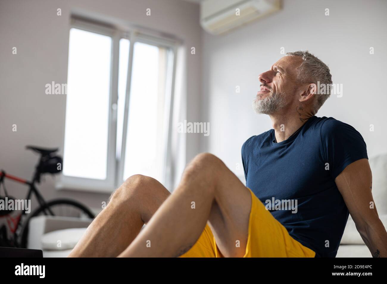 Thoughtful athlete is staring in a distance Stock Photo