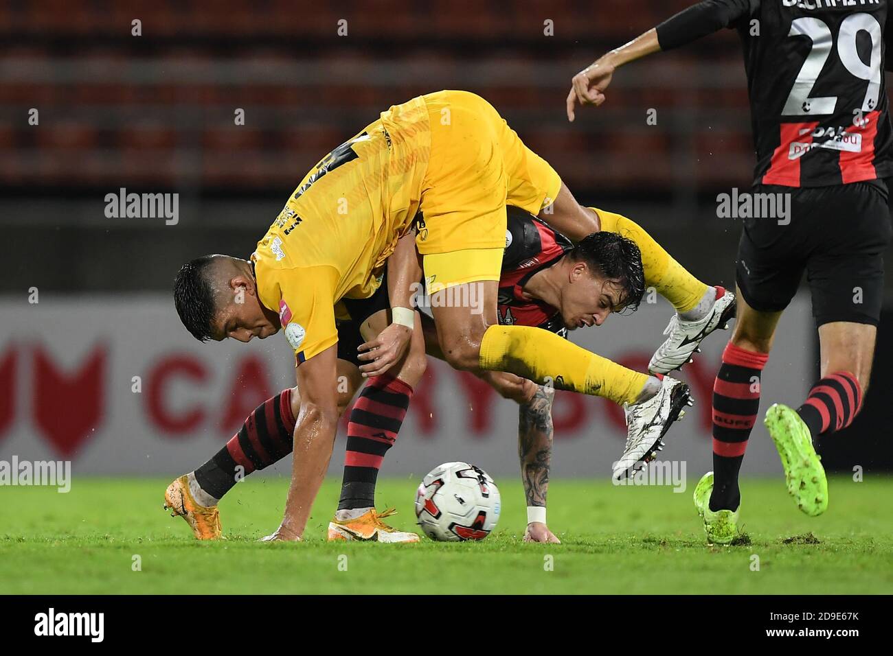 Tristan Do R Of Bangkok United F C And Elias Dolah L Of Port Fc Seen In Action During The Thai League Match Between Bangkok United F C And Port Fc At Thammasat