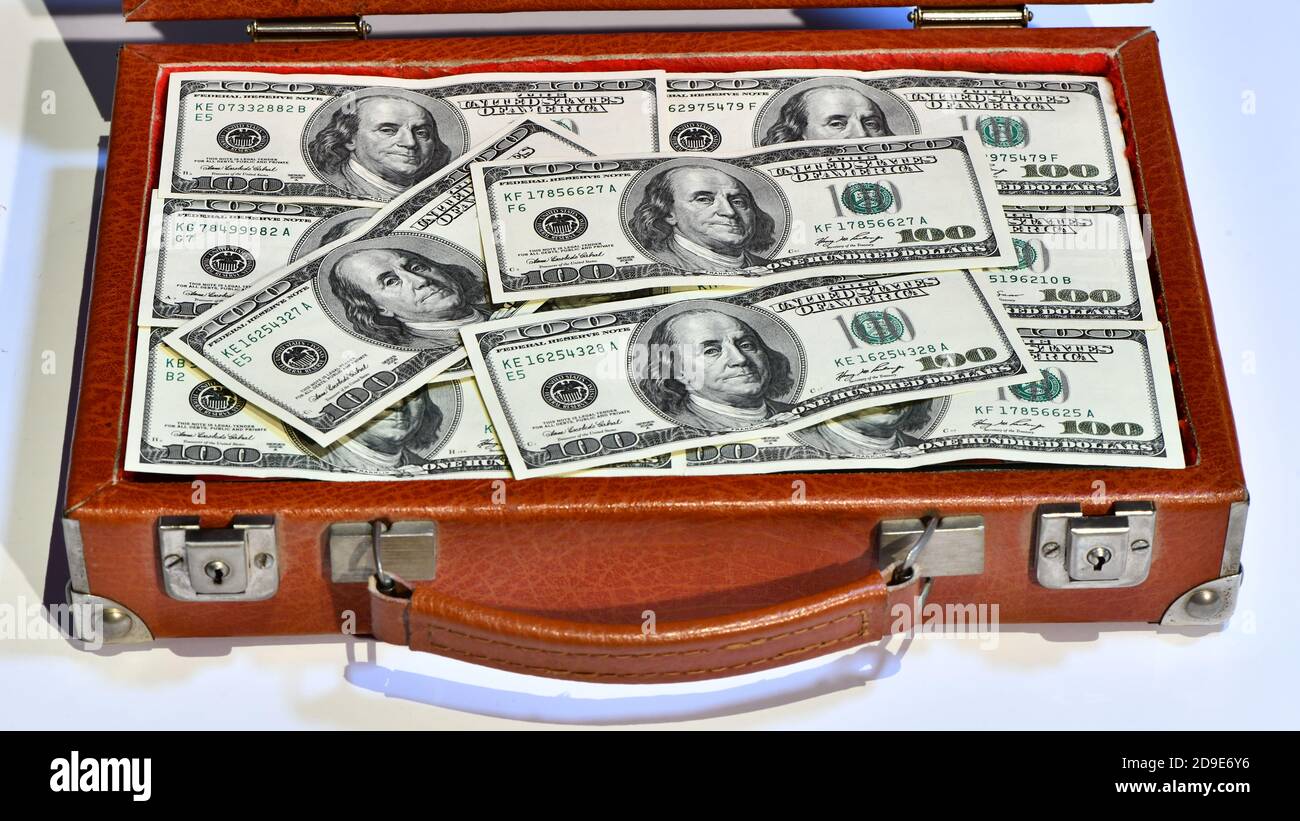 suitcase full of 100 dollar bills Stock Photo