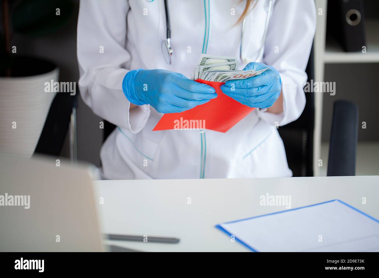 Doctor money envelope hi-res stock photography and images - Alamy