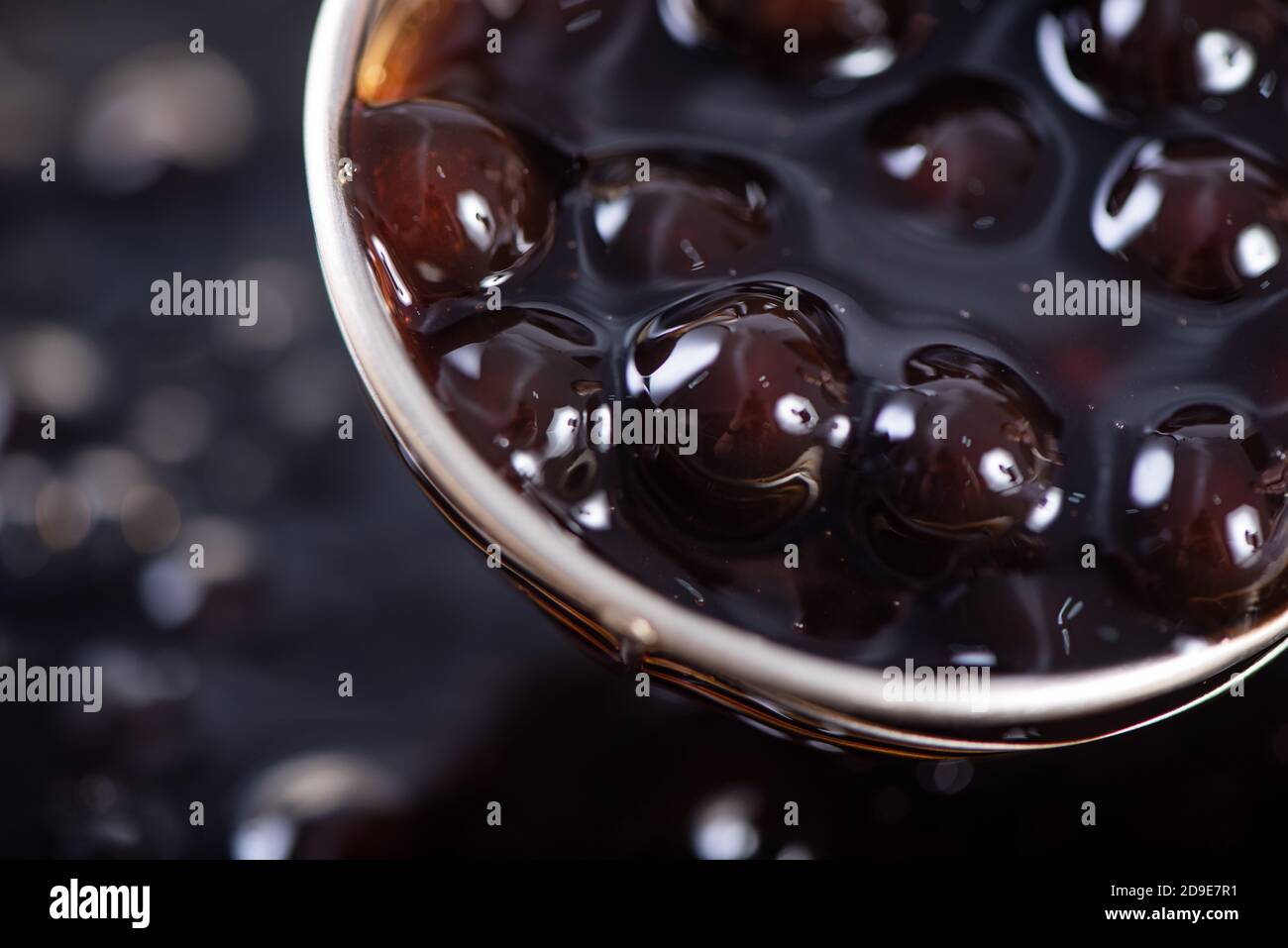 Cooking, boiling brown sugar flavored tapioca pearl balls, ingredient