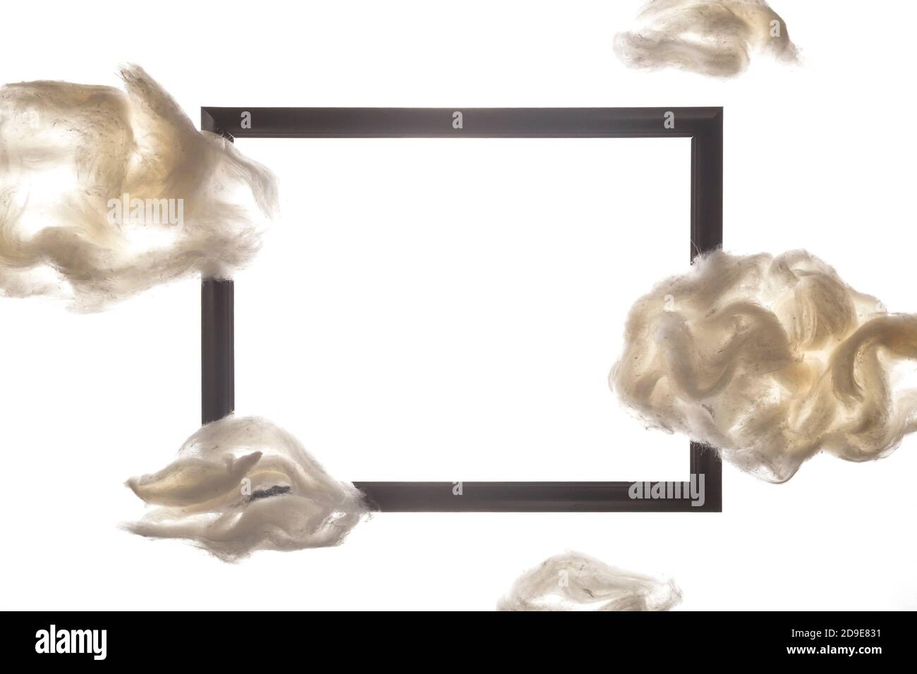 Black frame among white clouds on a white background Stock Photo