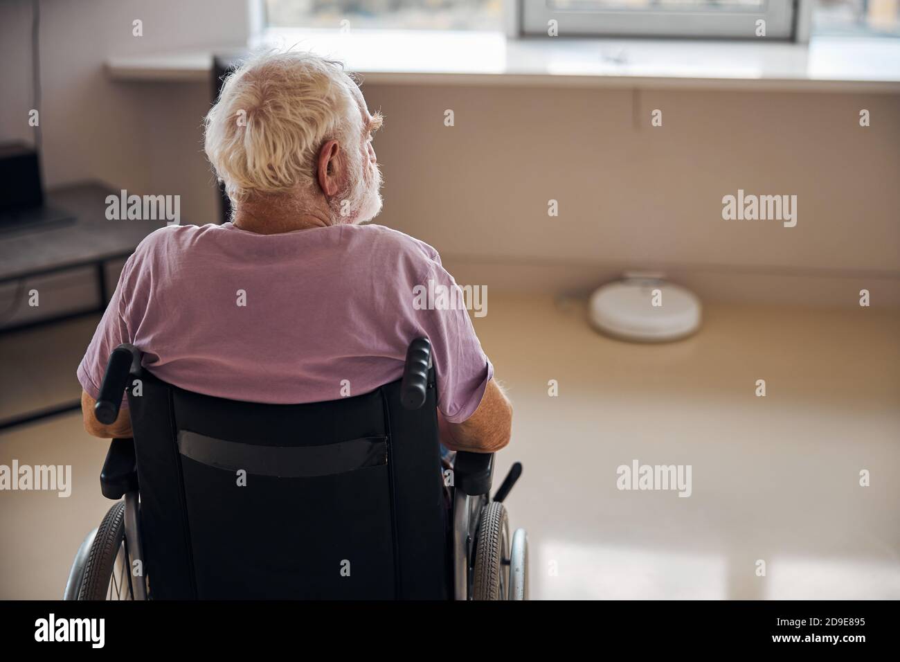 Disabled person in a t-shirt looking away Stock Photo