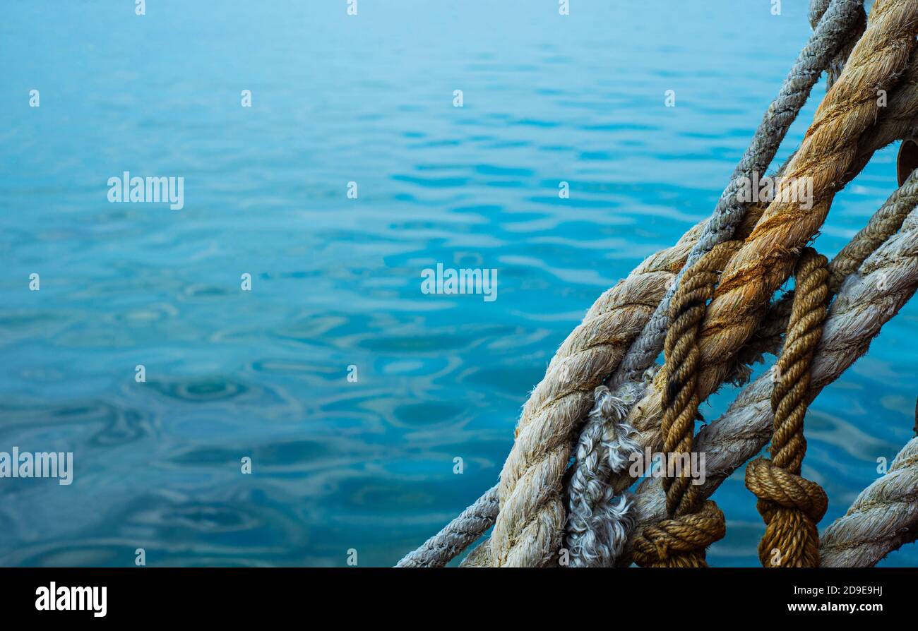 Marine background with ropes, ropes and cables. Marine frame. Copy space for text. Stock Photo