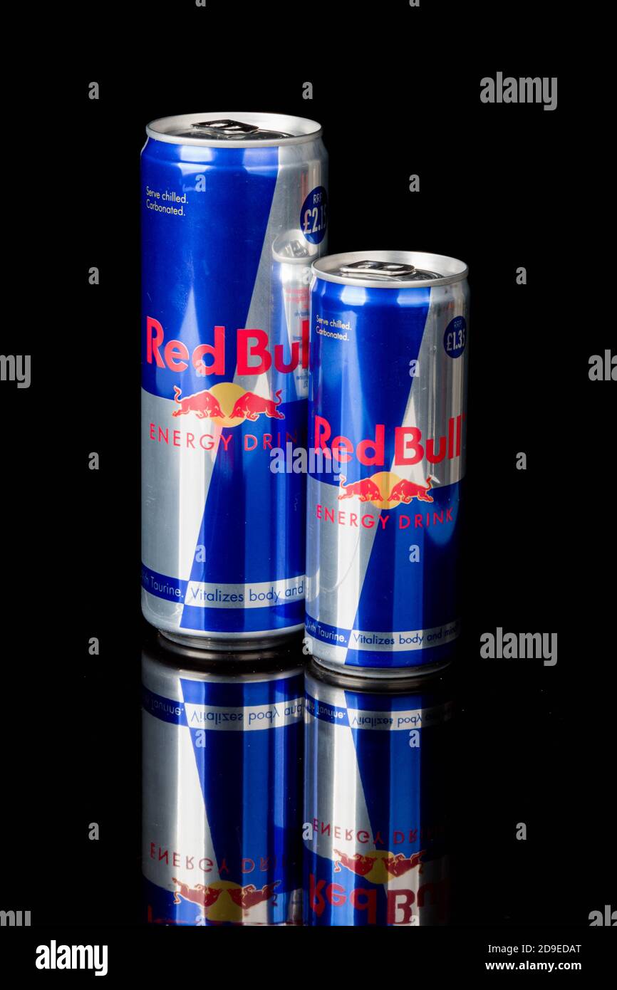 London, United Kingdom, 14th October 2020:- Cans of large and Small Red  Bull Energy Drinks Isolated on a black background Stock Photo - Alamy
