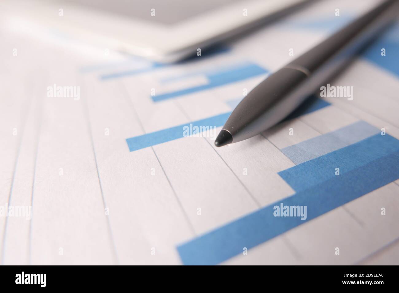 financial graph, digital tablet and pen on table  Stock Photo