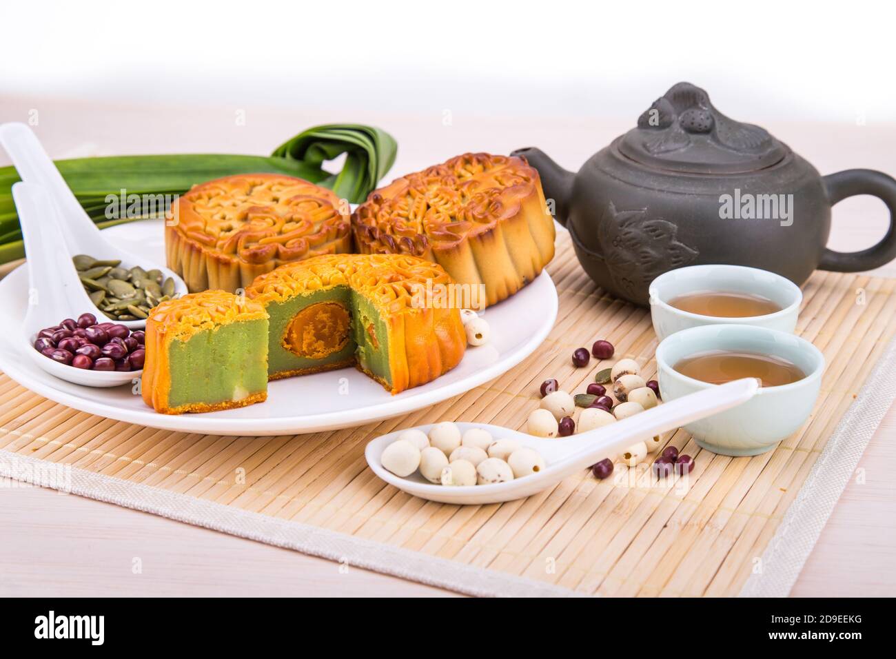 Mooncake for Chinese mid-autumn festival celebration, wih ingredients and tea. Stock Photo
