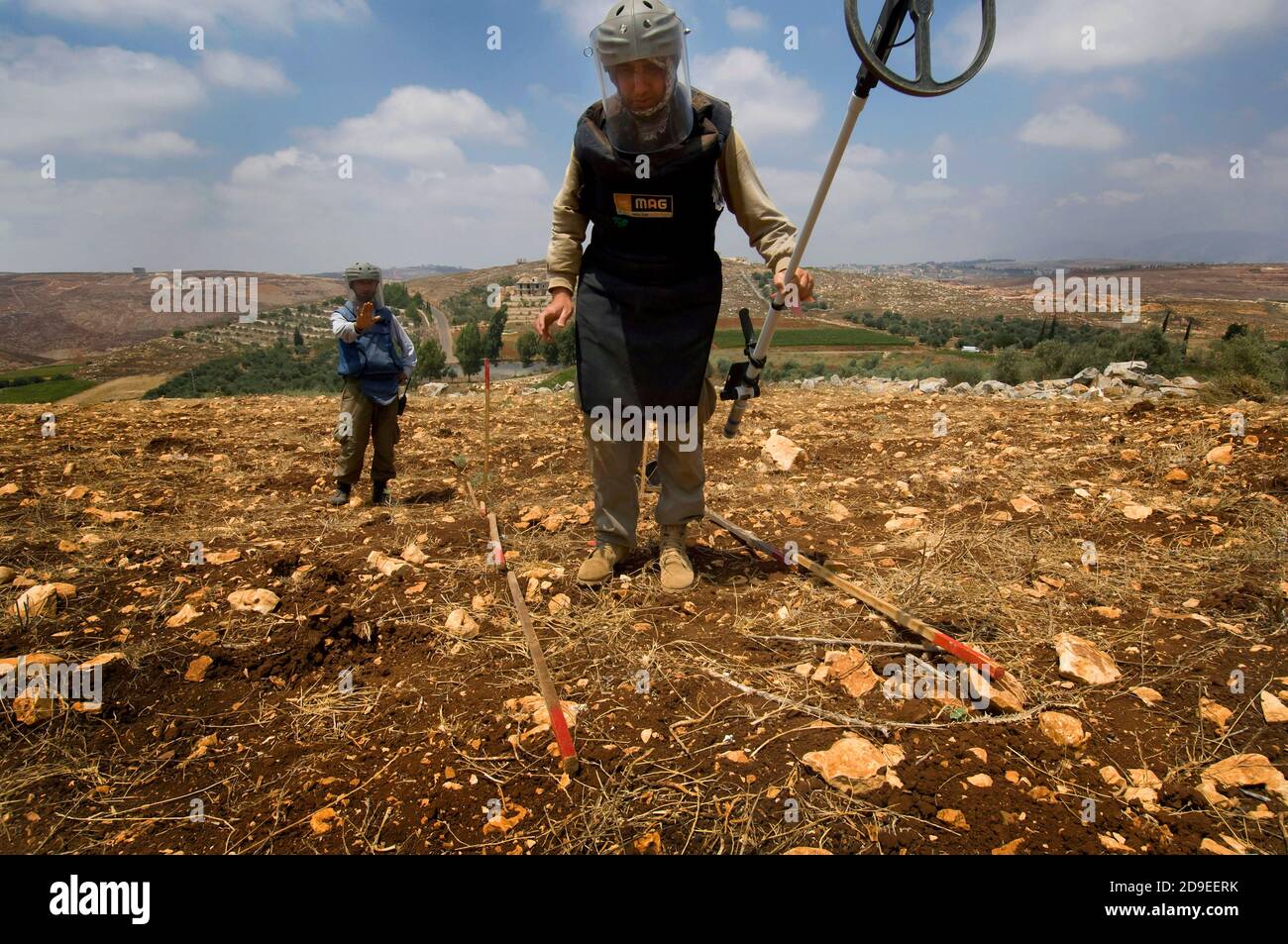 Tyre, Lebanon. July 15th 2010  A team from The Mines Advisory Group (MAG) clearing unexploded cluster munitions in the farmland of southern Lebanon. Stock Photo