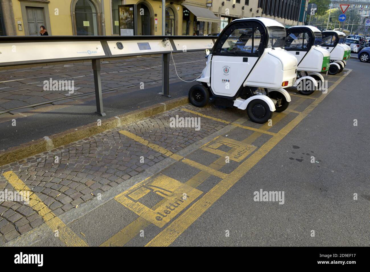 Public electric car recharging a parking spot, in Milan, Italy. Stock Photo