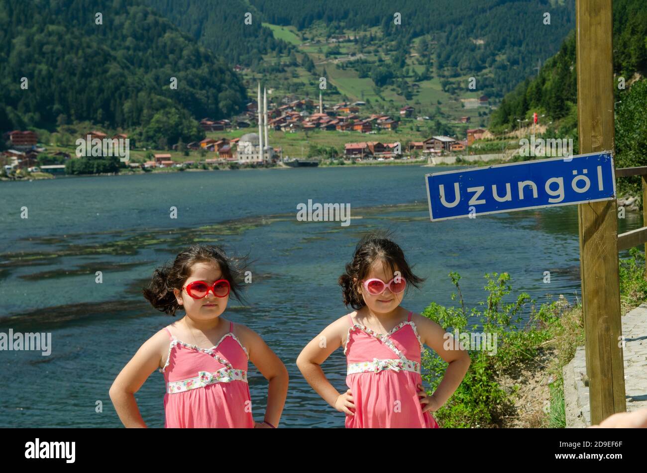 Trabzon, Turkey. 6th September 2014 Two young girls pose for photographs beside the lake at Uzungol in the Black Sea Mountains of Trabzon Province, Ea Stock Photo
