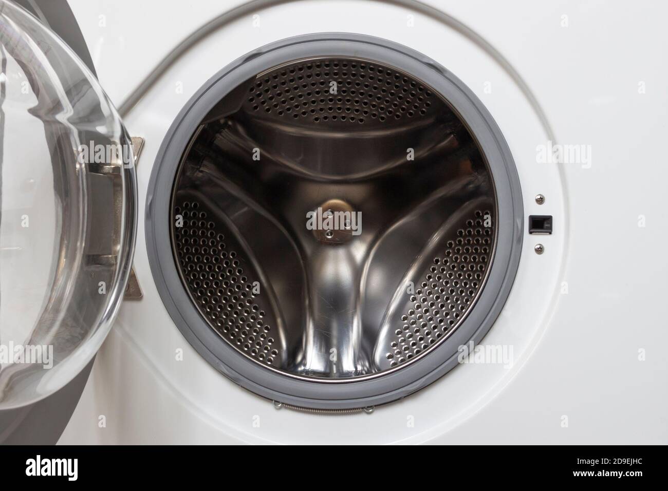 Open door in an empty washing machine Stock Photo Alamy