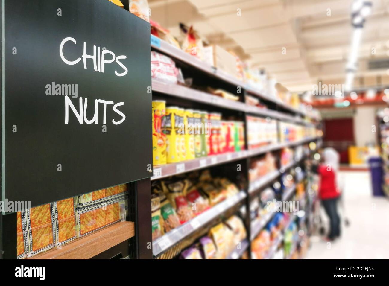 chips and Nuts grocery categoy aisle at supermarket Stock Photo Alamy