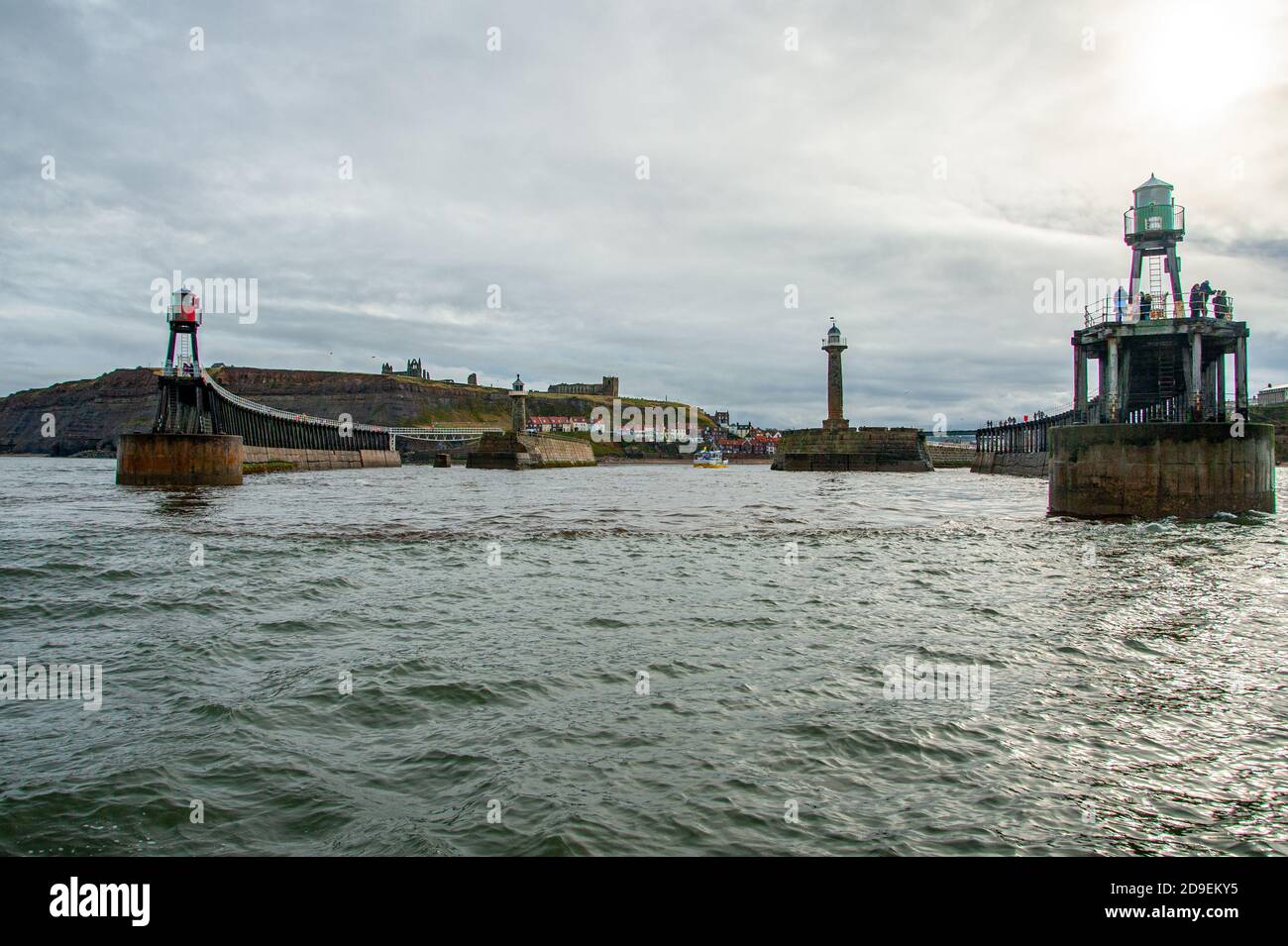 A view from the sea of the ends of the East and West piers and the mouth of the Harbour. Whitby Harbour, Whitby, Yorkshire, England. Stock Photo
