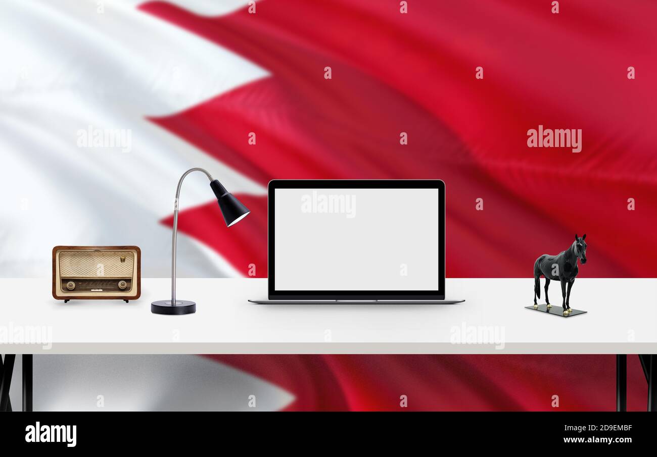 Bahrain national flag background with workspace, desktop computer and