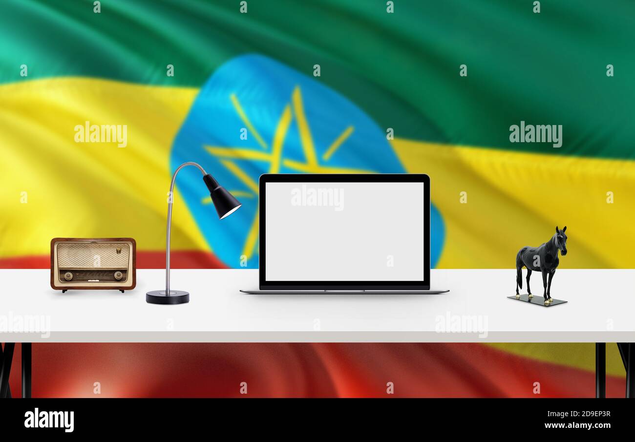 Ethiopia national flag background with workspace, desktop computer and office accessories on