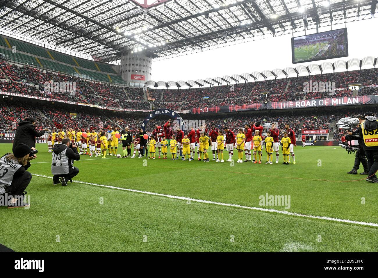 AC Milan and Frosinone soccer teams enter at the san siro soccer stadium for the italian serie A match, in Milan. Stock Photo