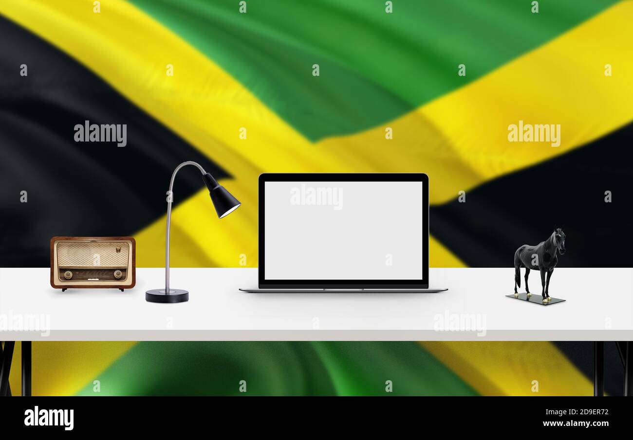 Jamaica national flag background with workspace, desktop computer and