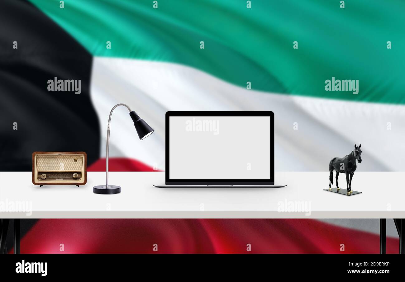 Kuwait national flag background with workspace, desktop computer and