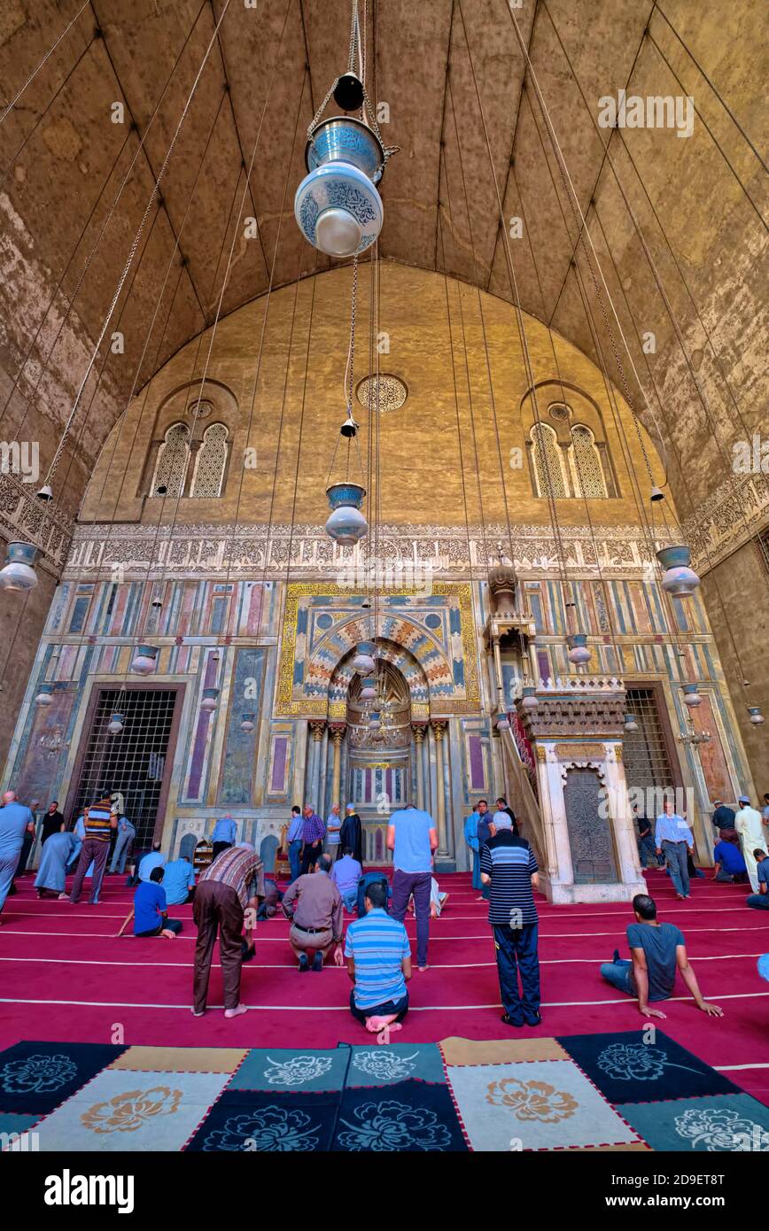 The Mosque-Madrassa of Sultan Hassan is a massive mosque and madrassa located in the Old city of Cairo, it was built during the Mamluk Islamic era in Stock Photo