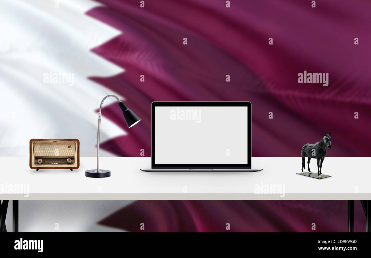 Qatar national flag background with workspace, desktop computer and