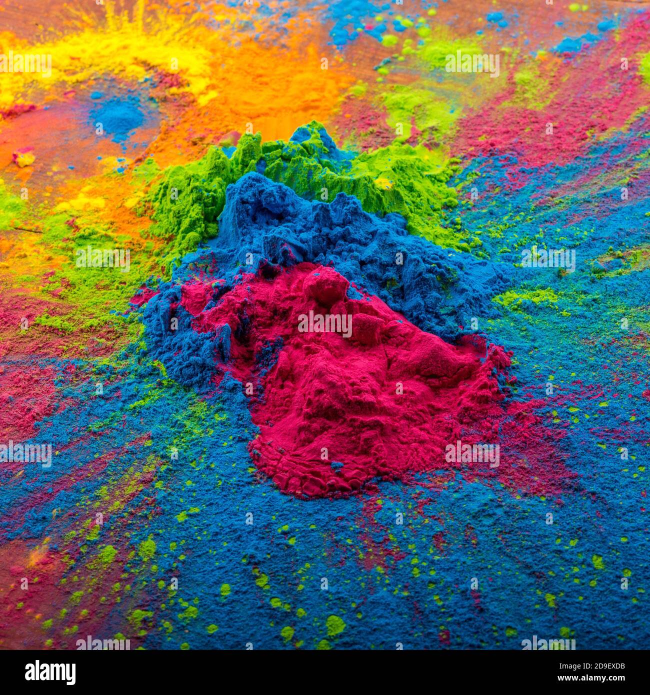 Happy Holi decoration, the indian festival.Top view of colorful holi powder  on dark background. Stock Photo