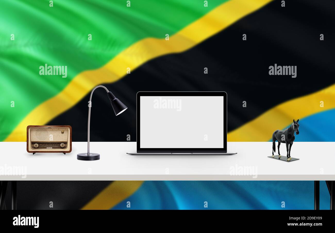 Tanzania national flag background with workspace, desktop computer and