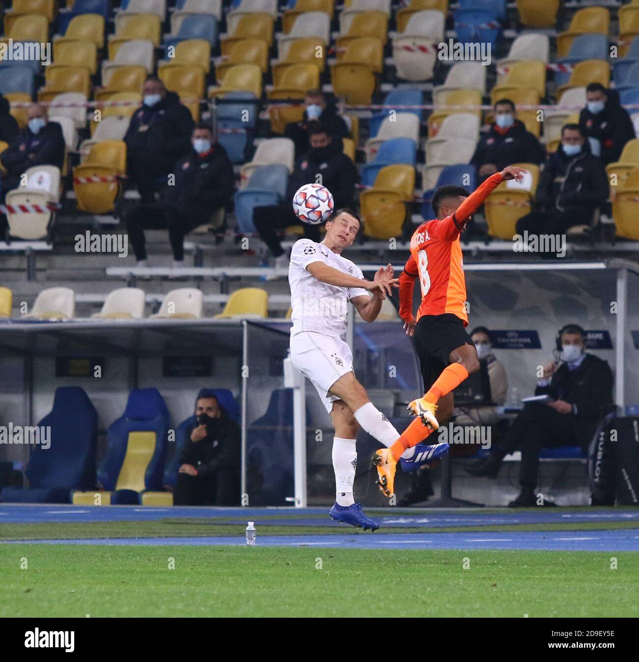 KYIV, UKRAINE - NOVEMBER 3, 2020: Stefan Lainer of Monchengladbach (L) fights for a ball with Marcos Antonio of Shakhtar Donetsk during their UEFA Champions League game at NSC Olimpiyskyi stadium Stock Photo