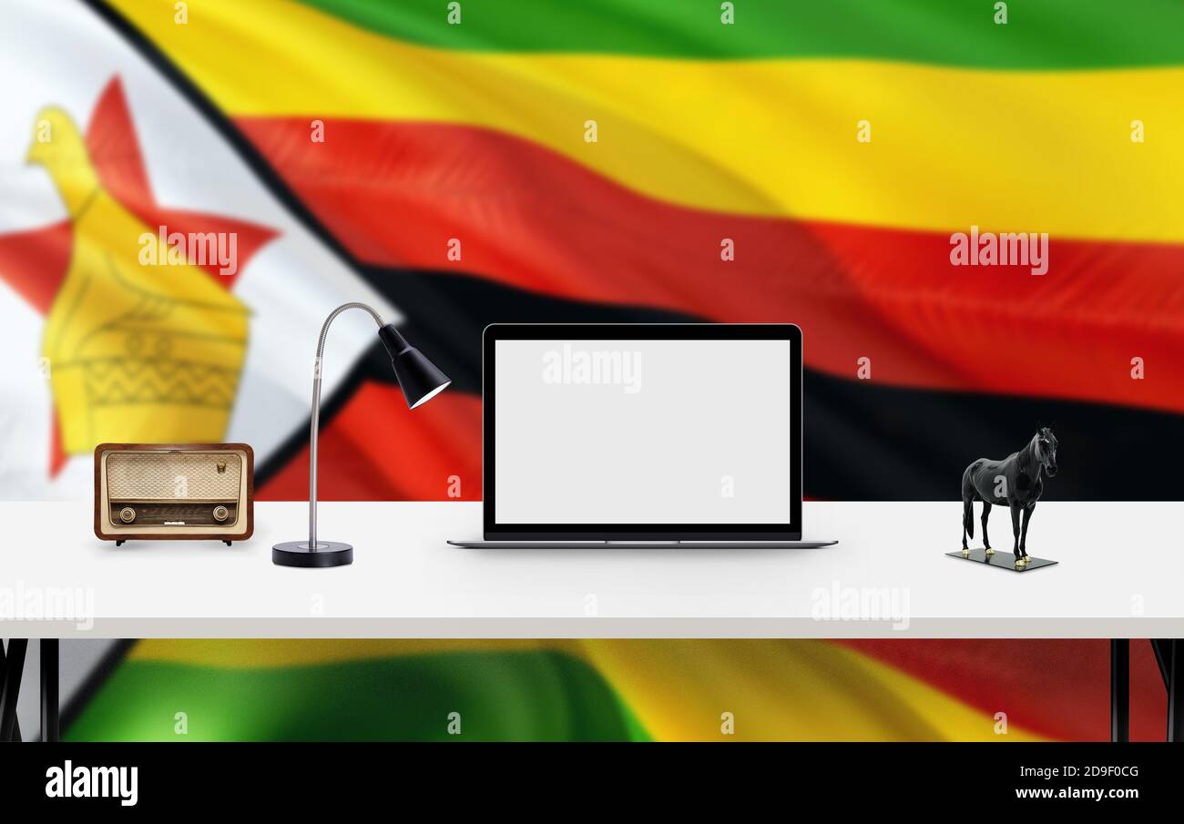 Zimbabwe national flag background with workspace, desktop computer and