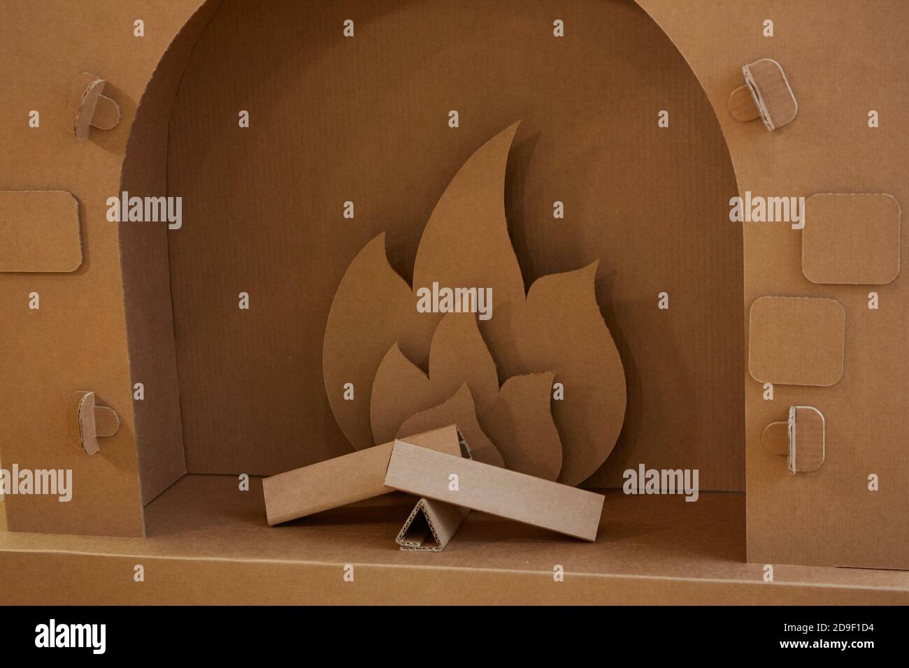 Cardboard fireplace. Closeup of firewood burning in fire Stock Photo Alamy