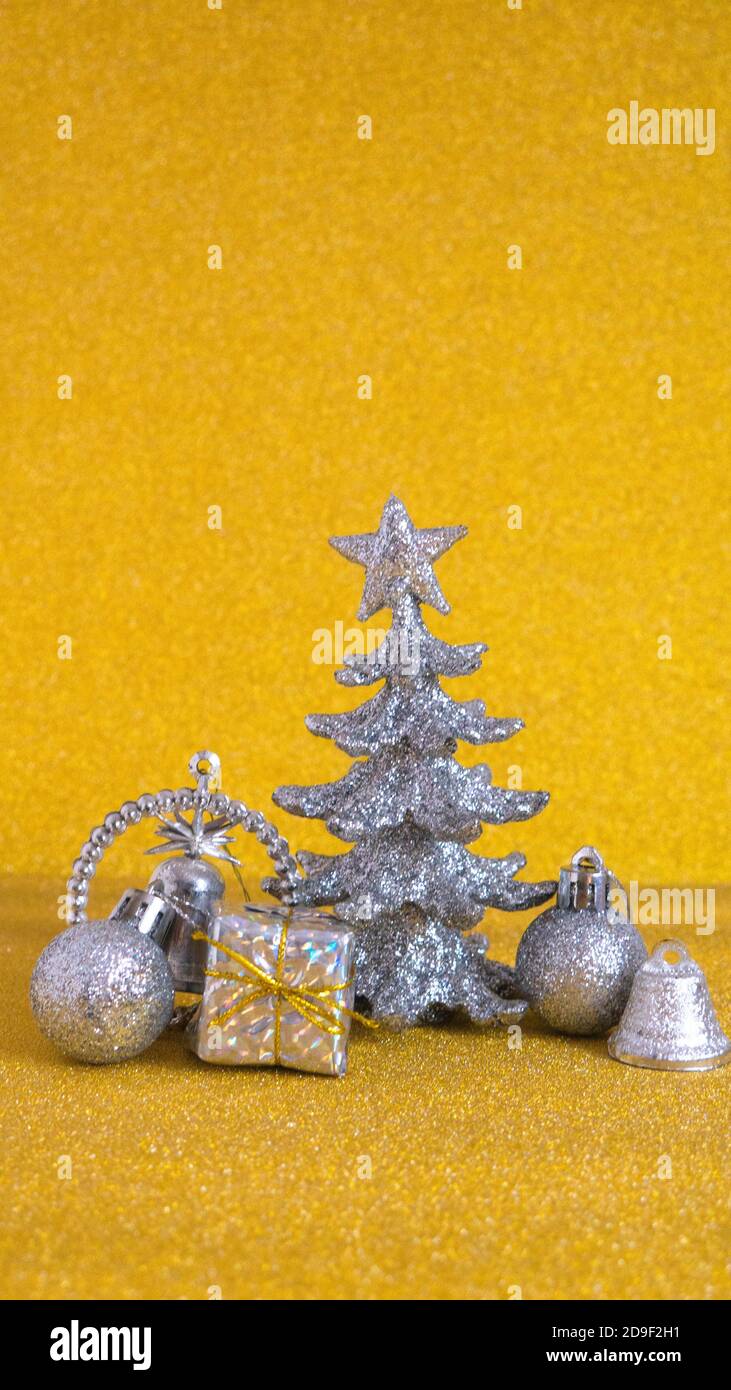 Silver New Year and Christmas decorations on a gold background Stock ...