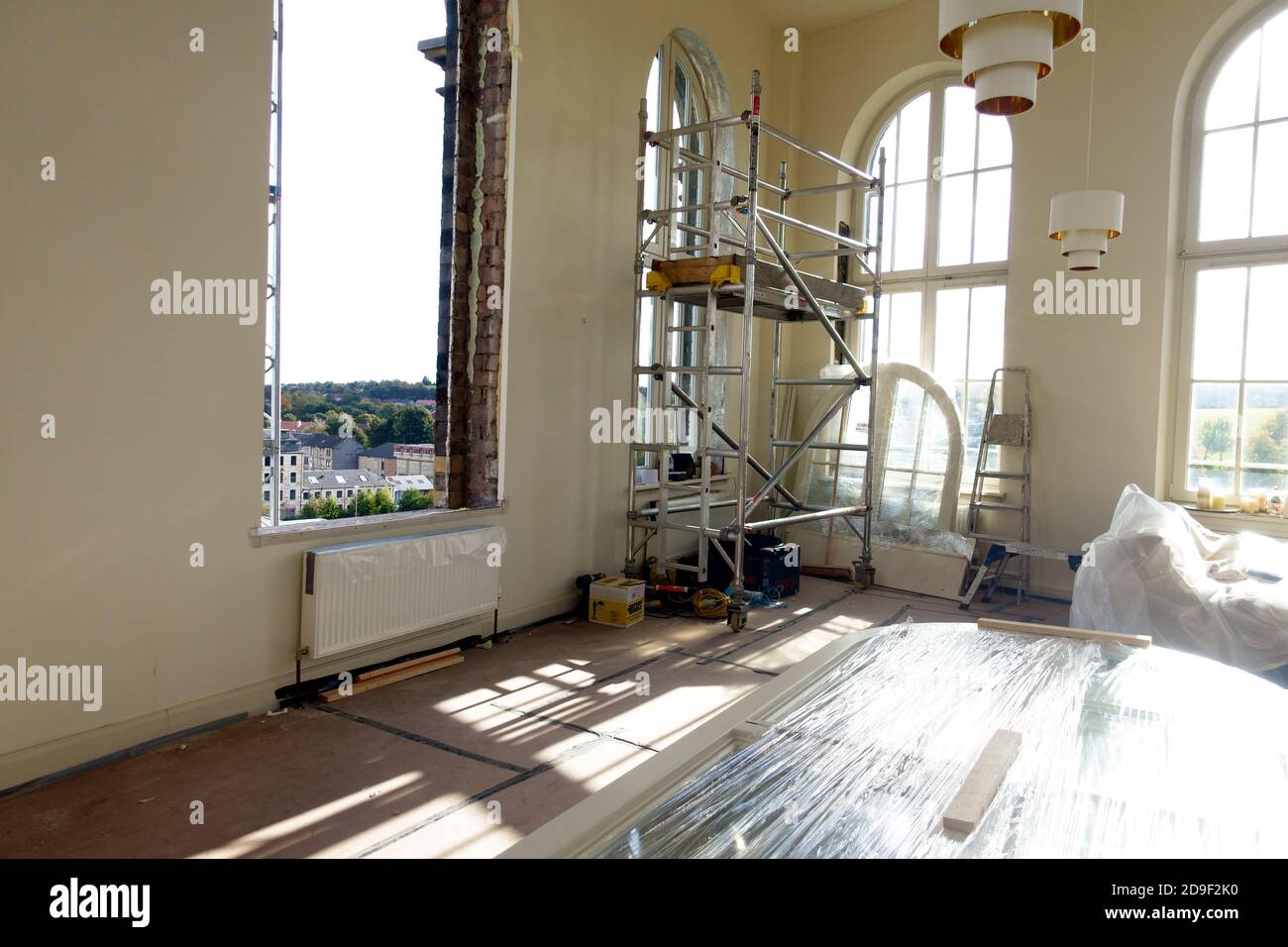 Replacement windows being put in to a 19th century converted mill in Paisley, Scotland Stock Photo