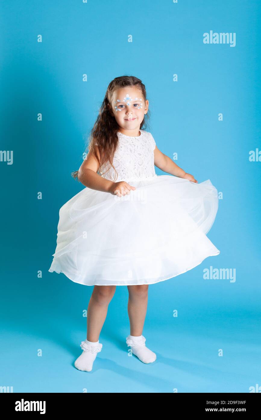 full-length portrait of a girl in a white Princess dress with a