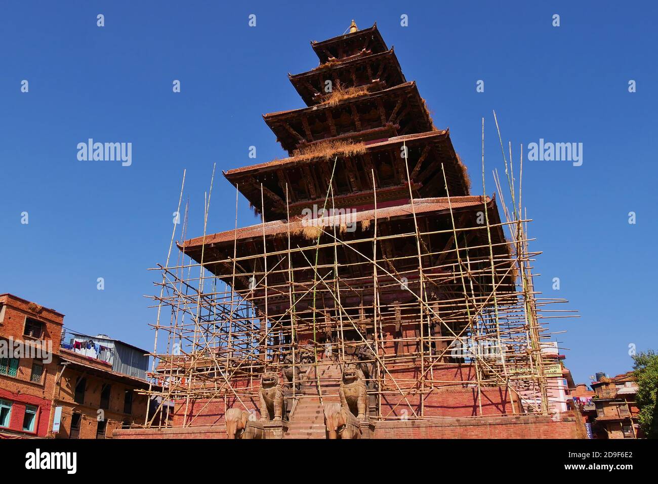Historic Nyatapola temple, the highest pagoda in Nepal, in Bhaktapur Durbar Square with scaffolding around. Stock Photo
