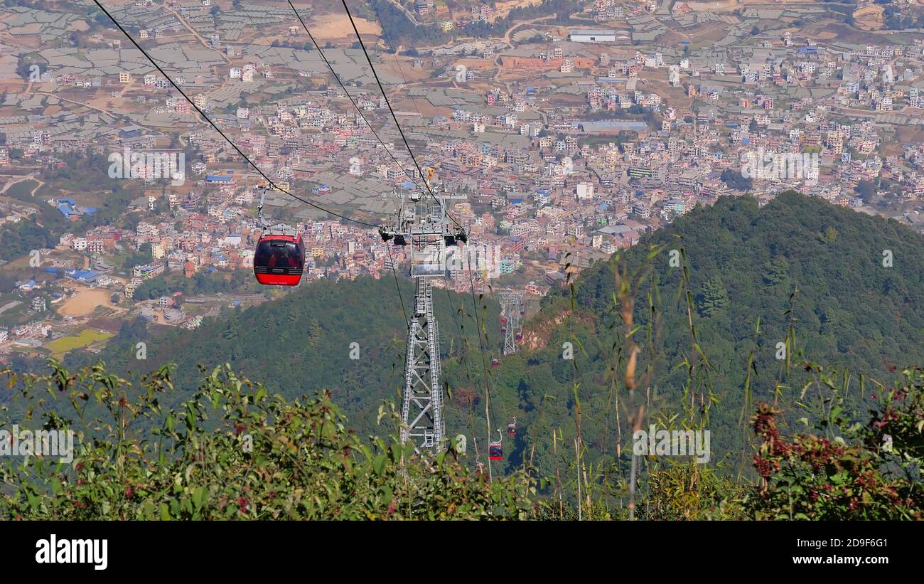 Red colored gondolas and pillars of Chandragiri Hills cable car with