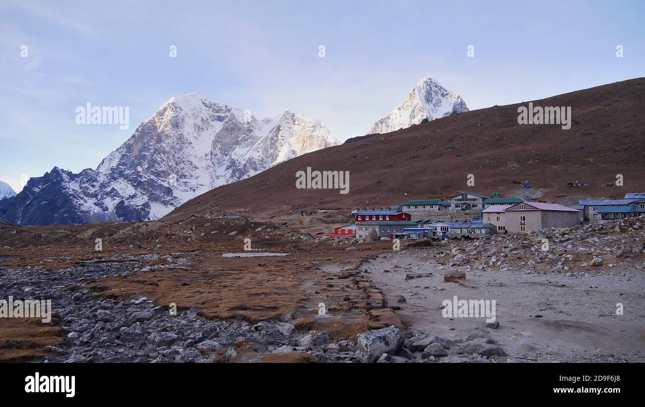 View of small Sherpa village Lobuche (altitude 4,940 m), one of the last stops on Everest Base Camp Trek, with stone houses (mainly lodges). Stock Photo
