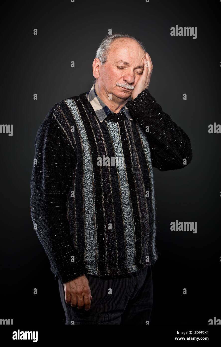 elderly man suffering from a toothache Stock Photo
