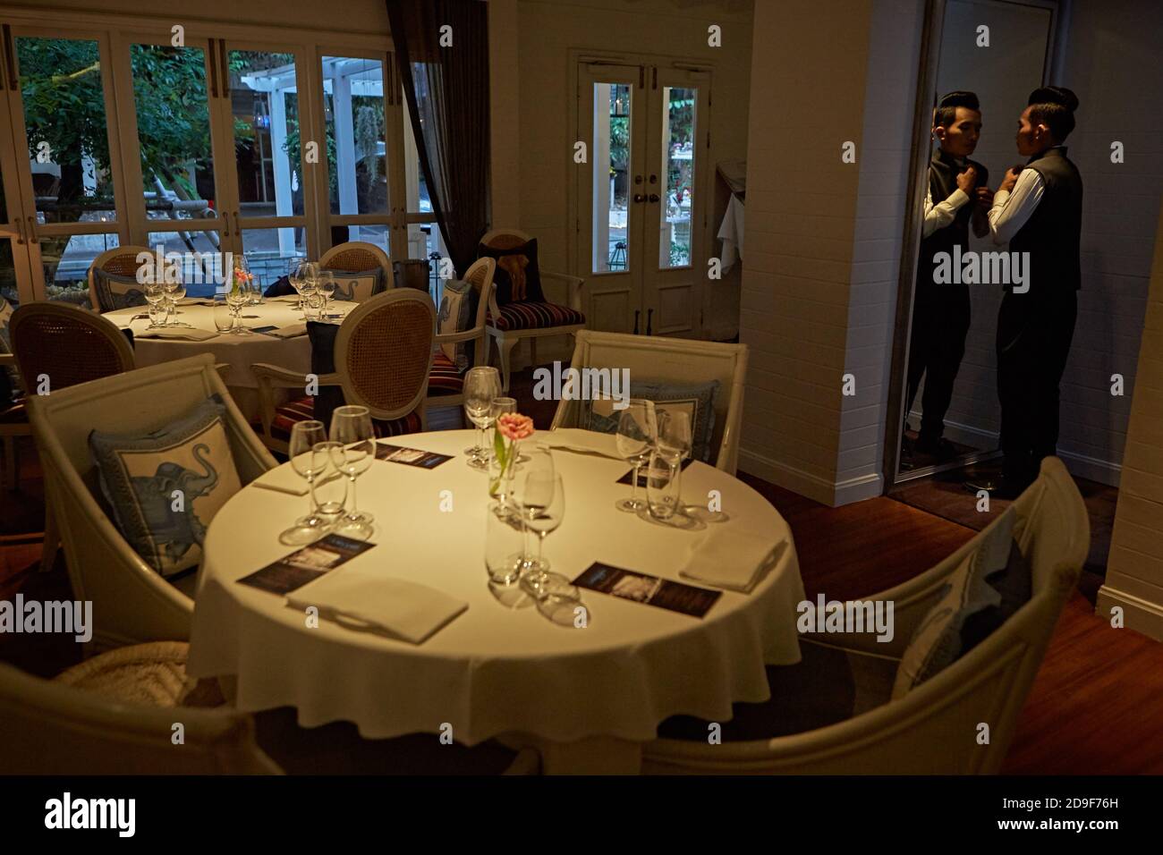 Bangkok, Thailand, March 2016. Preparing the tables of the Gaggan restaurant for dinner Stock