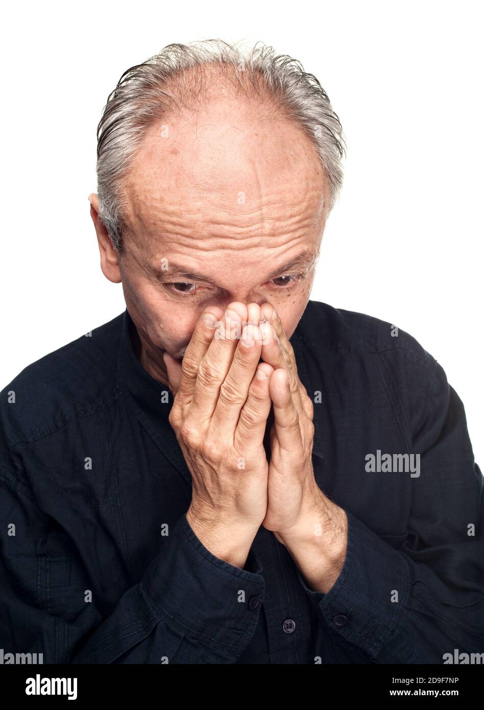 Elderly man covers his face with hand Stock Photo - Alamy