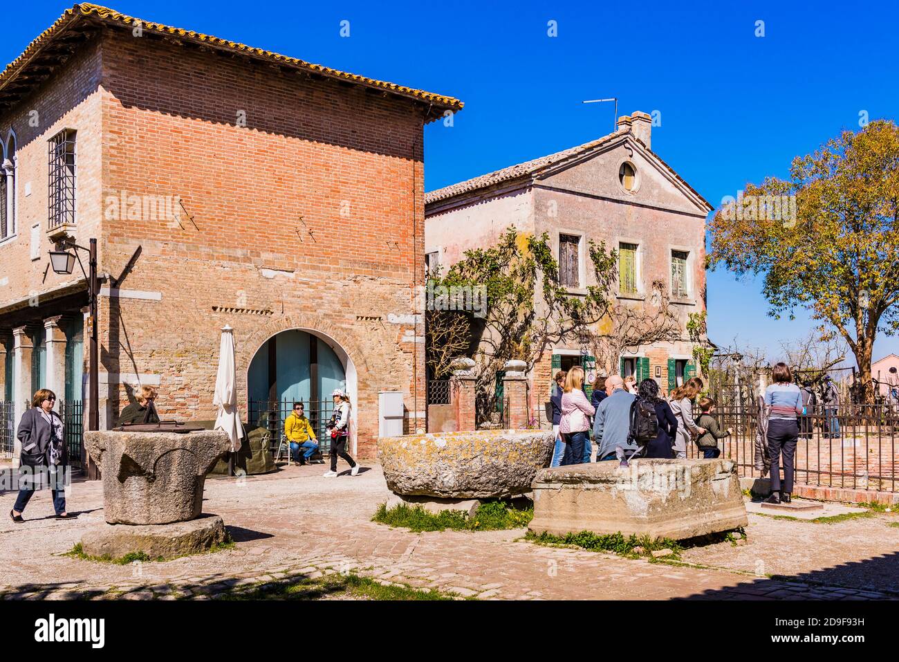 Tourists walking through the main square. Torcello, Venetian Lagoon, Venice, Veneto, Italy, Europe Stock Photo