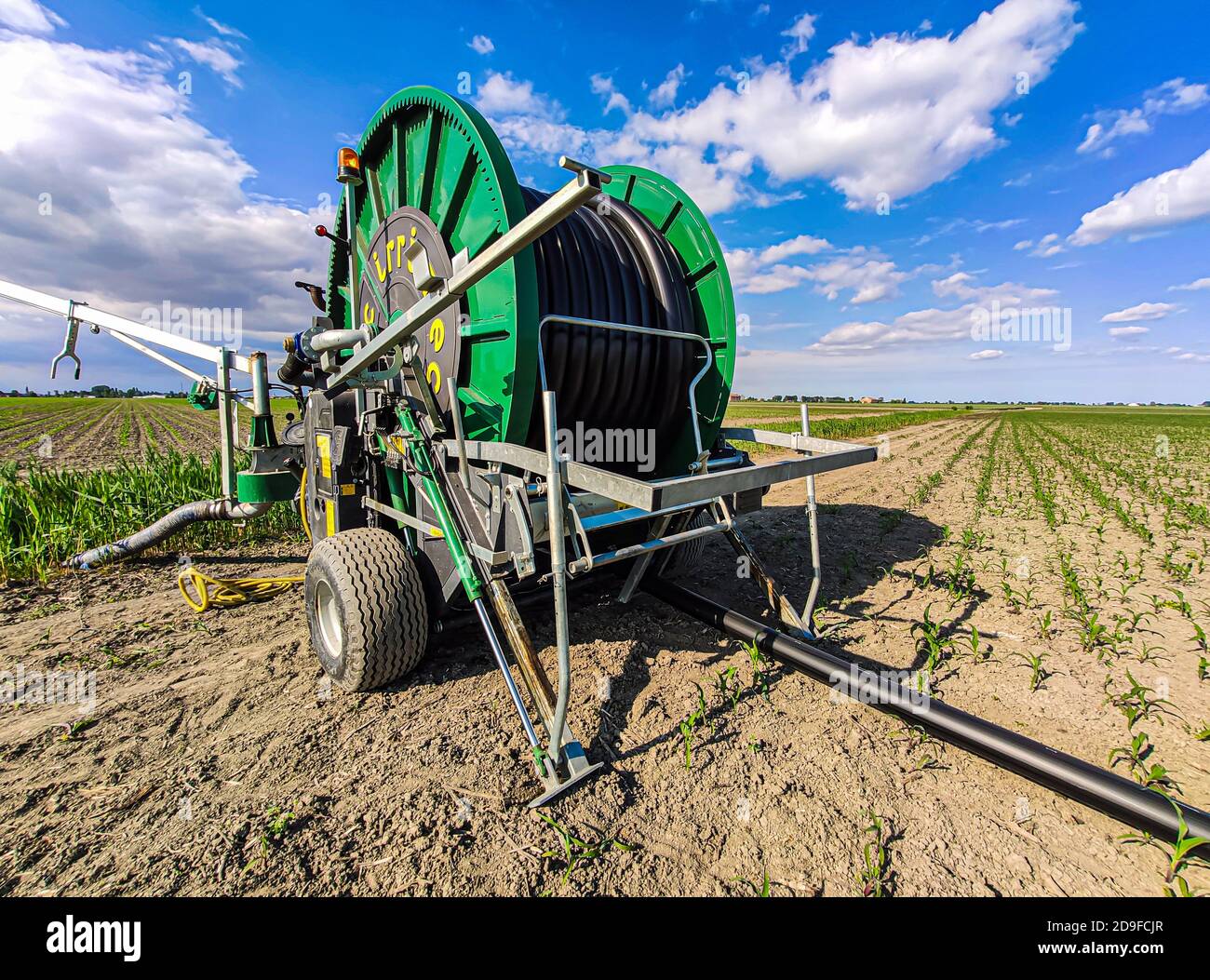 VILLANOVA DEL GHEBBO, ITALY 7 MAY 2020: Hose reel sprinkler in fields Stock Photo