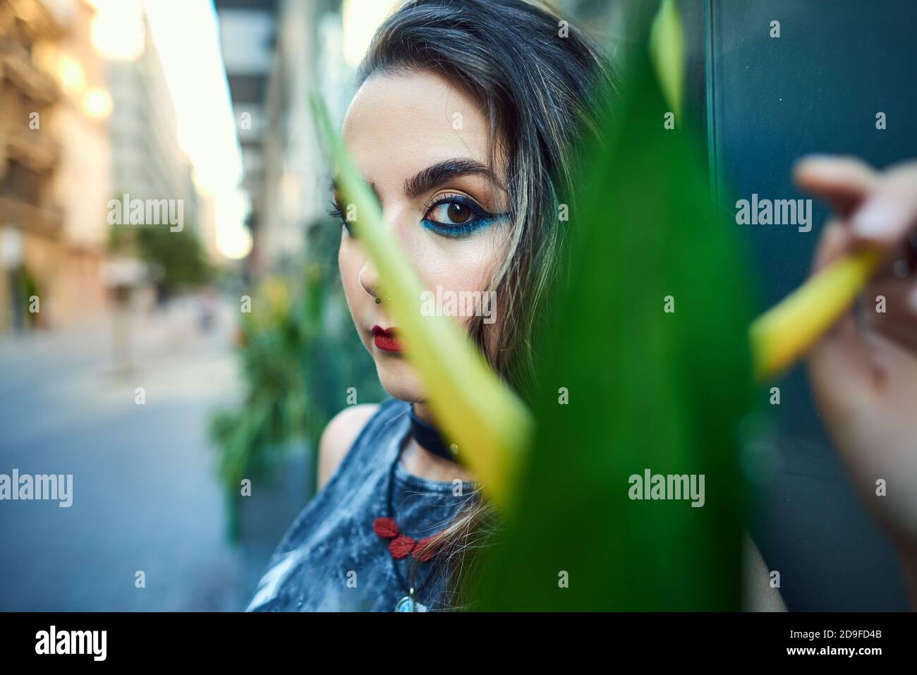 Young woman with urban style posing on the street. Stock Photo