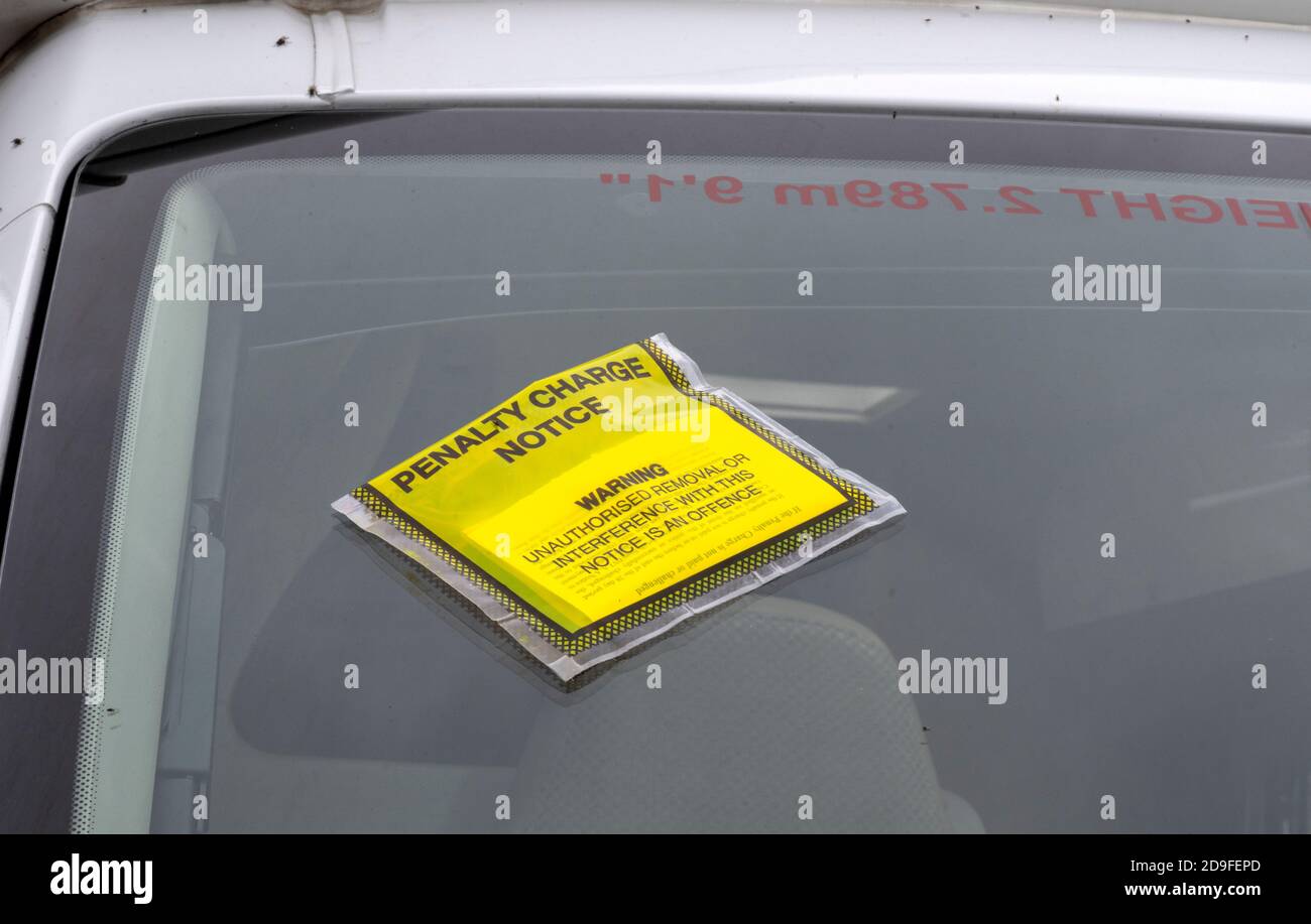 Fixed penalty parking ticket attached to the offending vehicles windscreen, New Forest , Hampshire, UK. Stock Photo