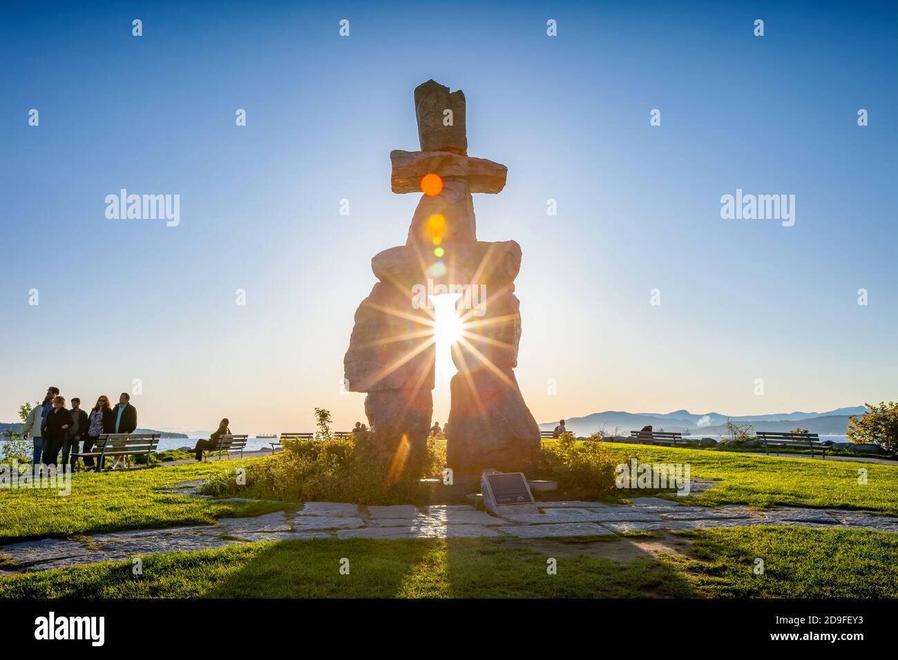 Inukshuk, an outdoor inuksuk by Alvin Kanak, installed at Vancouver's English Bay, in British Columbia, Canada. Stock Photo