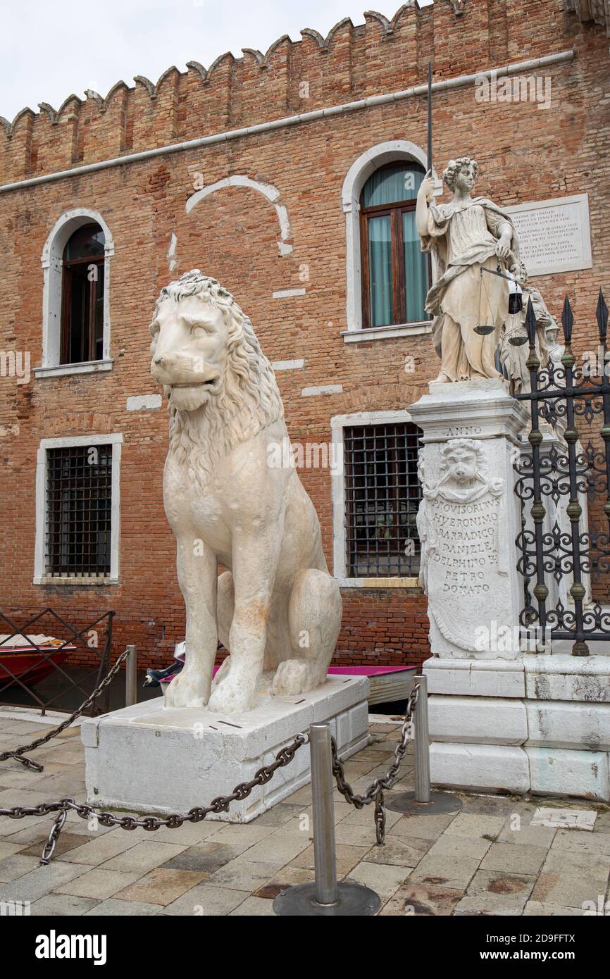 The famous marble Piraeus Lion statue an ancient Greek lion at the entrance to the Venetian Arsenal.  Venice, Italy Stock Photo