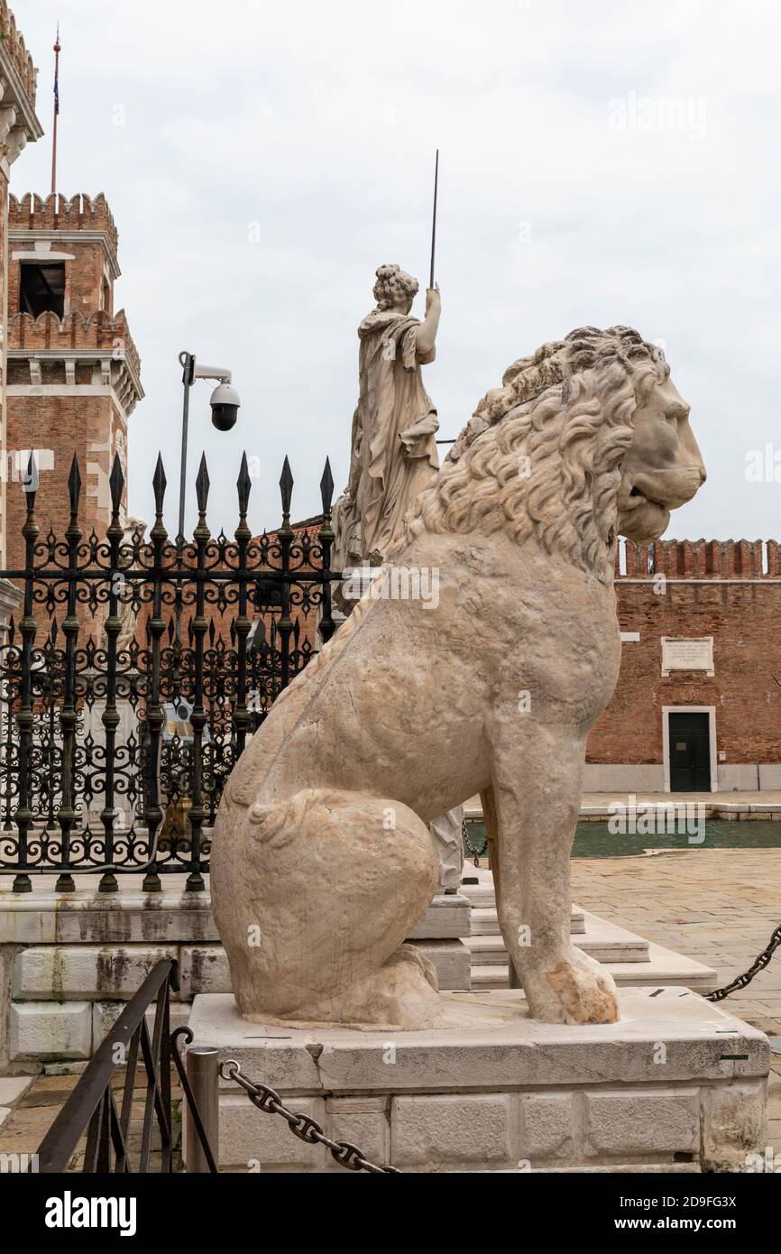 The famous marble Piraeus Lion statue an ancient Greek lion at the entrance to the Venetian Arsenal.  Venice, Italy Stock Photo